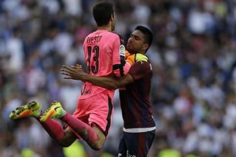Eibar's goalkeeper Asier Riesgo, left, and Mauro Dos Santos celebrate after drawing the Spanish La Liga soccer match between Real Madrid and Eibar at the Santiago Bernabeu Stadium in Madrid, Sunday, Oct. 2, 2016. (AP Photo/Francisco Seco)