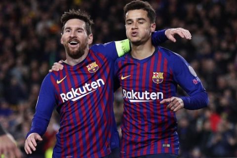 Barcelona forward Philippe Coutinho, right, celebrates with Barcelona forward Lionel Messi after scoring his side's second goal during the Champions League round of 16, 2nd leg, soccer match between FC Barcelona and Olympique Lyon at the Camp Nou stadium in Barcelona, Spain, Wednesday, March 13, 2019. (AP Photo/Manu Fernandez)