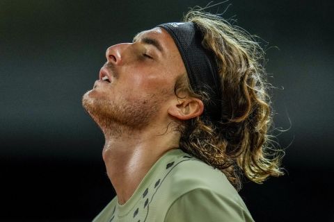 Greece's Stefanos Tsitsipa reacts against Alexander Zverev of Germany during a men's semifinal at the Mutua Madrid Open tennis tournament in Madrid, Spain, Saturday, May 7, 2022. (AP Photo/Manu Fernandez)