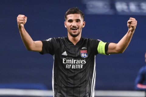 Lyon's Houssem Aouar celebrates after his team's win in the Champions League quarterfinal match against Manchester City at the Jose Alvalade stadium in Lisbon, Portugal, Saturday, Aug. 15, 2020. (Franck Fife/Pool Photo via AP)