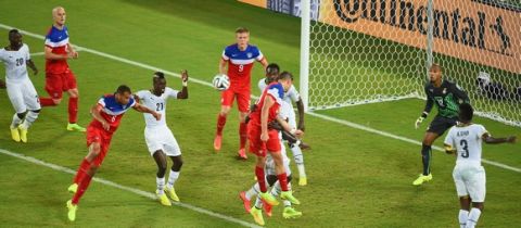NATAL, BRAZIL - JUNE 16: John Brooks of the United States scores his team's second goal on a header past Adam Kwarasey of Ghana during the 2014 FIFA World Cup Brazil Group G match between Ghana and the United States at Estadio das Dunas on June 16, 2014 in Natal, Brazil.  (Photo by Laurence Griffiths/Getty Images)