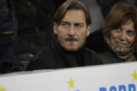 Francesco Totti, Italian former player of rome and Italy, watch at the start of Serie A soccer match between Inter Milan and Roma, at the San Siro stadium in Milan, Italy, Friday, Dec.6, 2019. (AP Photo/Luca Bruno)