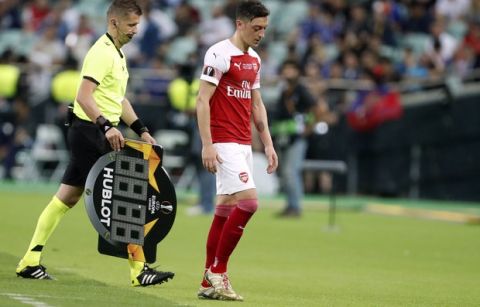 Arsenal's Mesut Ozil leaves the field after being substituted during the Europa League Final soccer match between Chelsea and Arsenal at the Olympic stadium in Baku, Azerbaijan, Thursday, May 30, 2019. (AP Photo/Darko Bandic)