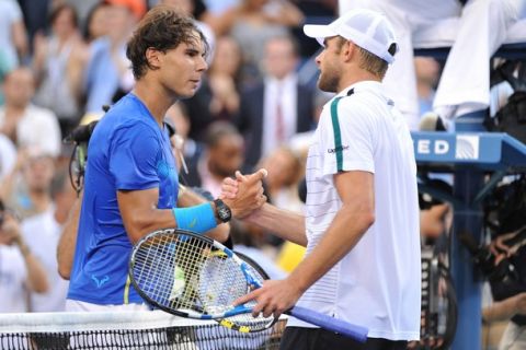 Number two seed Rafael Nadal of Spain (L) shakes hands with Andy Roddick of the US (R) after Nadal won,  6-2, 6-1, 6-3, during a Men's Quarterfinal match at the US Open tennis tournament September 9, 2011 at the Billie Jean King National Tennis Center in New York. AFP PHOTO/Stan HONDA (Photo credit should read STAN HONDA/AFP/Getty Images)