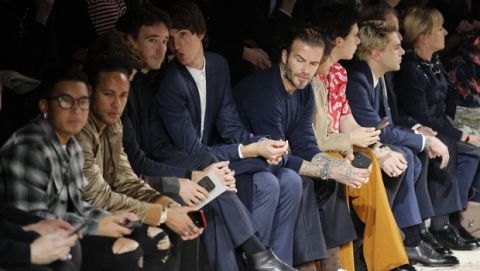 Former soccer player David Beckham, centre, and soccer player Neymar, second from left, watch the Louis Vuitton men's Fall-Winter 2018/2019 fashion collection presented in Paris, Thursday, Jan.18, 2018. (AP Photo/Francois Mori)