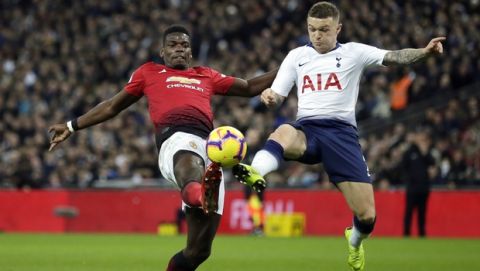 Manchester United's Paul Pogba vies for the ball with Tottenham's Kieran Trippier, right, during the English Premier League soccer match between Tottenham Hotspur and Manchester United at Wembley stadium in London, England, Sunday, Jan. 13, 2019. (AP Photo/Tim Ireland)