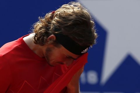 Greece's Stefanos Tsitsipas wipes his forehead during the Barcelona Open Tennis Tournament final with Spain's Rafael Nadal in Barcelona, Spain, Sunday, April 29, 2018. (AP Photo/Manu Fernandez)