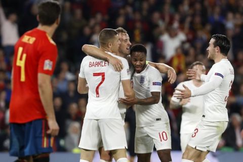 England's players celebrate the third goal of their team during the UEFA Nations League soccer match between Spain and England at Benito Villamarin stadium, in Seville, Spain, Monday, Oct. 15, 2018. (AP Photo/Miguel Morenatti)