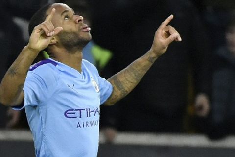 Manchester City's Raheem Sterling celebrates after scoring his side's second goal during the English Premier League soccer match between Wolverhampton Wanderers and Manchester City at the Molineux Stadium in Wolverhampton, England, Friday, Dec. 27, 2019. (AP Photo/Rui Vieira)