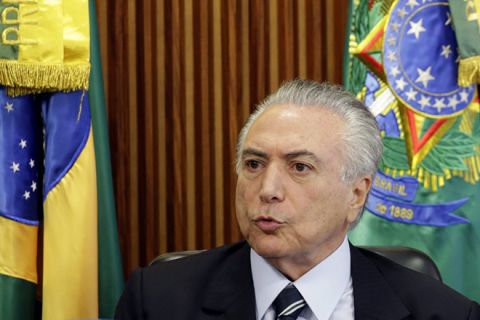 epa05303841 Brazilian interim President Michel Temer speaks during his first cabinet meeting at Planalto Presidential Palace in Brasilia, Brazil, 13 May 2016. Hundreds of Brazilians had protested on late 12 May against the former vice president to Dilma Rousseff, who was suspended from office after the Senate decided to impeach her. Protesters said that they will not recognize the 'legitimacy' of Temer's government, adding that they will take to the streets again in the coming days, not to defend Rousseff but to protect 'democracy and social rights.'  EPA/FERNANDO BIZERRA
