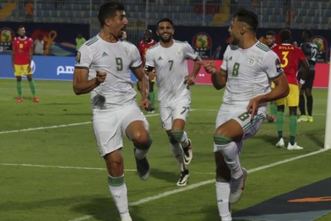 Algerian players celebrate after a goal during the African Cup of Nations round of 16 soccer match between Algeria and Guinea in 30 June stadium in Cairo, Egypt, Sunday, July 7, 2019. (AP Photo/Hassan Ammar)