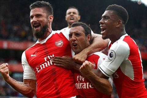 LONDON, ENGLAND - SEPTEMBER 10:  Santi Cazorla of Arsenal celebrates scoring his sides second goal with his team mates during the Premier League match between Arsenal and Southampton at Emirates Stadium on September 10, 2016 in London, England.  (Photo by Clive Rose/Getty Images)