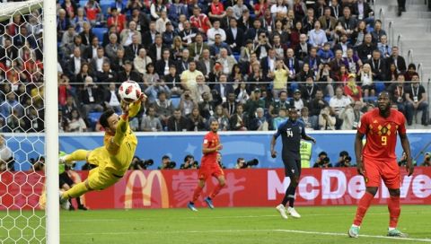 France goalkeeper Hugo Lloris deflects a shot by Belgium's Toby Alderweireld during the semifinal match between France and Belgium at the 2018 soccer World Cup in the St. Petersburg Stadium in St. Petersburg, Russia, Tuesday, July 10, 2018. (AP Photo/Martin Meissner)