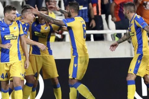 APOEL's Andrija Pavlovic, second left, celebrates with his teammates his second goal against Dudelange during the Europa League group A soccer match between APOEL Nicosia and Dudelange at GSP stadium in Nicosia, Cyprus, Thursday, Sept. 19, 2019. (AP Photo/Petros Karadjias)