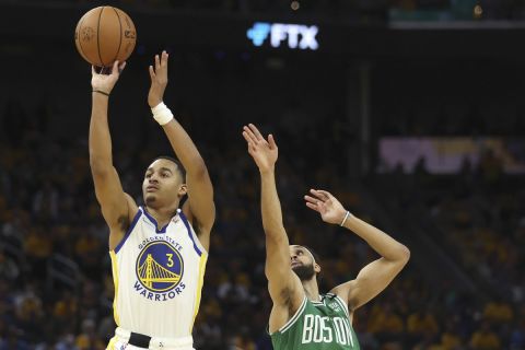 CORRECTS TO GAME 2 INSTEAD OF GAME 1 - Golden State Warriors guard Jordan Poole (3) shoots against Boston Celtics guard Derrick White during the second half of Game 2 of basketball's NBA Finals in San Francisco, Sunday, June 5, 2022. (AP Photo/Jed Jacobsohn)