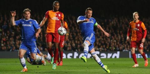 LONDON, ENGLAND - MARCH 18:  John Terry of Chelsea (R) misses a chance as Branislav Ivanovic of Chelsea (L) and Didier Drogba of Galatasaray (C) look on during the UEFA Champions League Round of 16 second leg match between Chelsea and Galatasaray AS at Stamford Bridge on March 18, 2014 in London, England.  (Photo by Clive Rose/Getty Images)