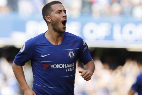 Chelsea's Eden Hazard celebrates scoring his side's first goal during their English Premier League soccer match between Chelsea and Cardiff City at Stamford Bridge stadium in London Saturday, Sept. 15, 2018. (AP Photo/Alastair Grant)