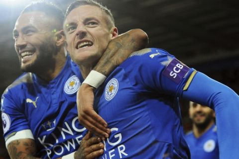 Leicester's Jamie Vardy, right, celebrates with Leicester's Danny Simpson after scoring during the English Premier League soccer match between Leicester City and Tottenham Hotspur at the King Power Stadium in Leicester, England, Tuesday, Nov. 28, 2017. (AP Photo/Rui Vieira)