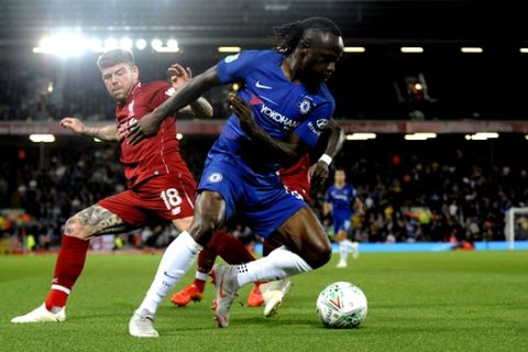 Chelsea's Victor Moses, right, duels for the ball with Liverpool's Alberto Moreno during the English League Cup soccer match between Liverpool and Chelsea at Anfield stadium in Liverpool, England, Wednesday, Sept. 26, 2018. (AP Photo/Rui Vieira)