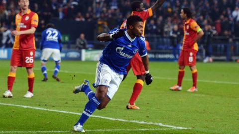 GELSENKIRCHEN, GERMANY - MARCH 12: Michel Bastos of Schalke celebrates after scoring his teams second goa during the UEFA Champions League round of 16 second leg match between FC Schalke 04 and Galatasaray AS at Veltins-Arena on March 12, 2013 in Gelsenkirchen, Germany.  (Photo by Lars Baron/Getty Images)