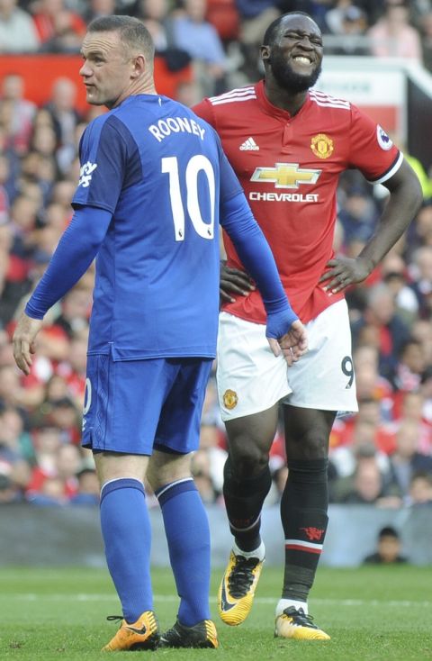Manchester United's Romelu Lukaku, right, and Everton's Wayne Rooney look on during the English Premier League soccer match between Manchester United and Everton at Old Trafford in Manchester, England, Sunday, Sept. 17, 2017. (AP Photo/Rui Vieira)