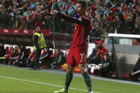 Portugals Cristiano Ronaldo celebrates after scoring his sides second goal during the World Cup Group B qualifying soccer match between Portugal and Hungary at the Luz stadium in Lisbon Saturday, March 25 2017. (AP Photo/Armando Franca)