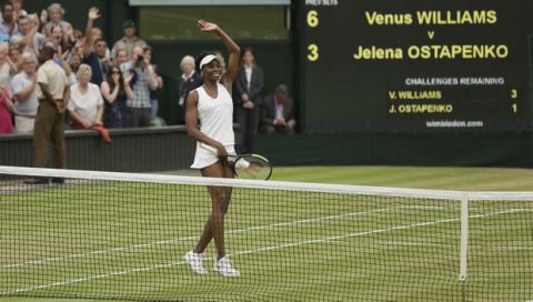 Venus Williams of the United States celebrates after beating Latvia's Jelena Ostapenko at the end of their Women's Quarterfinal Singles Match on day eight at the Wimbledon Tennis Championships in London, Tuesday, July 11, 2017. (AP Photo/Tim Ireland)