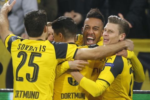 Dortmund's Pierre-Emerick Aubameyang, second from right, celebrates with his teammates after scoring the opening goal during the Champions League round of 16, second leg, soccer match between Borussia Dortmund and Benfica in Dortmund, Germany, Wednesday, March 8, 2017. (AP Photo/Michael Probst)