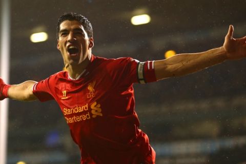 LONDON, ENGLAND - DECEMBER 15:  Luis Suarez of Liverpool celebrates scoring their fourth goal during the Barclays Premier League match between Tottenham Hotspur and Liverpool at White Hart Lane on December 15, 2013 in London, England.  (Photo by Paul Gilham/Getty Images)