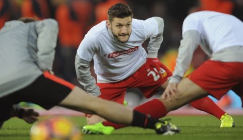 Liverpool's Adam Lallana warms up before the English Premier League soccer match between Liverpool and Tottenham Hotspur at Anfield, Liverpool, England, Saturday, Feb. 11, 2017. (AP Photo/Rui Vieira)