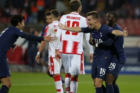 Tottenham's Giovani Lo Celso, 2nd right, Tanguy Ndombele, right, and Son Heung-min, left, celebrate after Lo Celso scored a goal against Red Star during their Champions League group B soccer match at the Rajko Mitic stadium in Belgrade, Serbia, Wednesday, Nov. 6, 2019. (AP Photo/Marko Drobnjakovic)