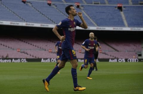 Barcelona's Sergio Busquets celebrates his goal during the Spanish La Liga soccer match between Barcelona and Las Palmas at the Camp Nou stadium in Barcelona, Spain, Sunday, Oct. 1, 2017. Barcelona's Spanish league game against Las Palmas is played without fans amid the controversial referendum on Catalonia's independence. (AP Photo/Manu Fernandez)