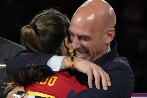 President of Spain's soccer federation Luis Rubiales embraces Alba Redondo during the awards ceremony for the Women's World Cup soccer final at Stadium Australia in Sydney, Australia, Sunday, Aug. 20, 2023. Spain defeated England in the final. (AP Photo/Rick Rycroft)