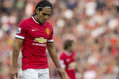 FILE - In this Sept. 14, 2014 file photo, Manchester United's Radamel Falcao Garcia walks on the field during his team's English Premier League soccer match at Old Trafford Stadium in Manchester, England. (AP Photo/Jon Super, File)