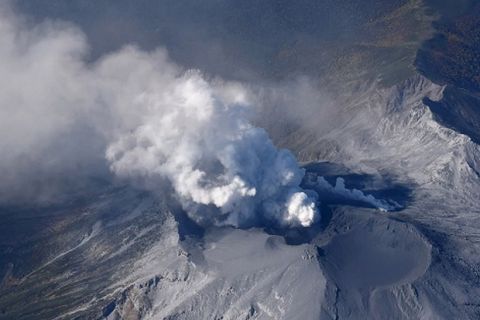 A photo shows a plume of volcanic smoke seen rising from  Mt. Ontake, which erupted the previous day  in stradding the border between  Gifu and Nagano Prefectures, central Japan on Sept. 28, 2014. The 3,067-meter voclcano,, erupted for the first time in 7 years.  According to the local polices's report, thirty-one people found in cardiopulmonary arrest and  fourty-five people have remained missing.  Japan's Meteorological Agency warned about the possibility of sizable volcanic rocks falling on areas within four kilomiters from the volcanic craters.  ( The Yomiuri Shimbun via AP Images )