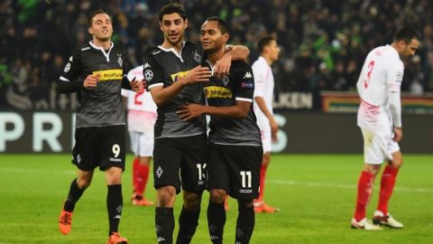 MOENCHENGLADBACH, GERMANY - NOVEMBER 25:  Raffael of Borussia Moenchengladbach (11) celebrates with Lars Stindl (13) as he scores their third goal during the UEFA Champions League Group D match between Borussia Moenchengladbach and Sevilla at Borussia-Park on November 25, 2015 in Moenchengladbach, Germany.  (Photo by Lars Baron/Bongarts/Getty Images)
