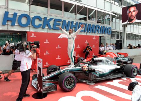 Mercedes driver Lewis Hamilton of Britain celebrates after winning the German Formula One Grand Prix at the Hockenheimring racetrack in Hockenheim, Germany, Sunday, July 22, 2018. (AP Photo/Jens Meyer)