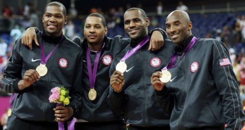 FILE - In this Aug. 12, 2012, file photo, members of the United States basketball team pose with their gold medals at the 2012 Summer Olympics in London. From left are Kevin Durant, Carmelo Anthony, LeBron James and Kobe Bryant. With two Olympic gold medals and a chance to be the first mens player to win three, Carmelo Anthony has become the unlikely face of USA Basketball, a rise that couldnt have been imagined 12 years ago. This 2016 star-studded American squad, missing some big names but still ferocious, needed someone to show the way. (AP Photo/Charles Krupa, File)