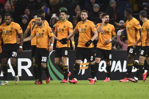 Wolverhampton Wanderers' Ruben Neves, third right, celebrates after scoring his side's second goal during the Europa League round of 32 match between Wolverhampton Wanderers and Espanyol at the Molineux Stadium, in Wolverhampton, England, Thursday, Feb. 20, 2020. (AP Photo/ Rui Vieira)