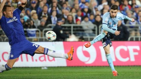 Chelsea's John Terry, left, attempts to block a shot from Sydney FC's Christopher Naumoff during their friendly soccer match in Sydney, Tuesday, June 2, 2015. (AP Photo/Rick Rycroft)