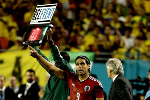 Colombia's Radamel Falcao (9) prepares to go in as a substitution in the second half of an international friendly soccer match against Brazil, Friday, Sept. 5, 2014, in Miami Gardens, Fla. Brazil defeated Colombia 1-0. (AP Photo/Lynne Sladky)