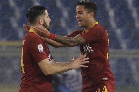 Roma's Justin Kluivert, right, celebrates with teammate Manolas after scoring during the Italian Serie A soccer match between Roma and Genoa in Rome's Olympic stadium, Sunday, Dec. 16, 2018. (AP Photo/Gregorio Borgia)