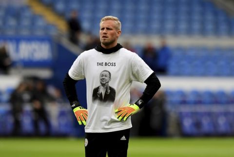 Leicester City goalkeeper Kasper Schmeichel wears a Vichai Srivaddhanaprabha shirt that reads 'The Boss' during the warm-up before kick-off of the English Premier League soccer match between Cardiff City and Leicester City at the Cardiff City Stadium, Cardiff. Wales. Saturday Nov. 3, 2018. (Simon Galloway/PA via AP)