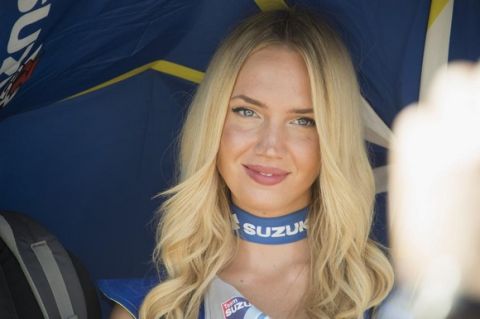 ALCANIZ, SPAIN - SEPTEMBER 24: A grid girl smiles in paddock during the qualifying practice during the MotoGP of Spain - Qualifying at Motorland Aragon Circuit on September 24, 2016 in Alcaniz, Spain.  (Photo by Mirco Lazzari gp/Getty Images)