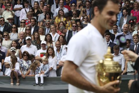 Mirka, the wife of Switzerland's Roger Federer and his family watch as he is interviewed after he defeated Croatia's Marin Cilic to win the Men's Singles final match on day thirteen at the Wimbledon Tennis Championships in London Sunday, July 16, 2017. (Daniel Leal-Olivas/Pool Photo via AP)