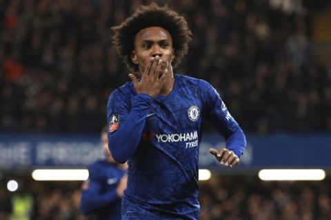 Chelsea's Willian celebrates after scoring his side's opening goal during the English FA Cup fifth round soccer match between Chelsea and Liverpool at Stamford Bridge stadium in London Tuesday, March 3, 2020. (AP Photo/Ian Walton)