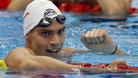 Alexis Manacas Santos, rear, from Portugal reacts as Andreas Vazaios, front, from Greece celebrates after winning the gold medal in the Men's 200m Individual Medley Final during the European Swimming Championships at the London Aquatics Centre in London, Wednesday, May 18, 2016. (AP Photo/Matt Dunham)
