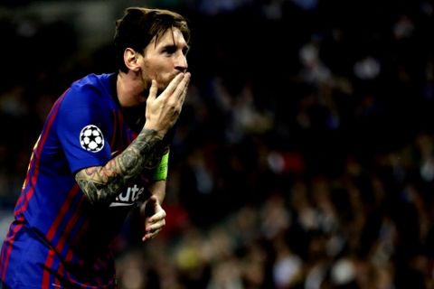 Barcelona forward Lionel Messi celebrates after scoring his side's third goal during the Champions League Group B soccer match between Tottenham Hotspur and Barcelona at Wembley Stadium in London, Wednesday, Oct. 3, 2018. (AP Photo/Kirsty Wigglesworth)