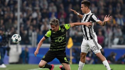 Juventus' forward from Argentina Paulo Dybala (R) fights for the ball with Sporting's midfielder Fabio Coentrao during the UEFA Champions League Group D football match Juventus vs Sporting CP at the Juventus stadium on October 17, 2017 in Turin.  / AFP PHOTO / Miguel MEDINA        (Photo credit should read MIGUEL MEDINA/AFP/Getty Images)