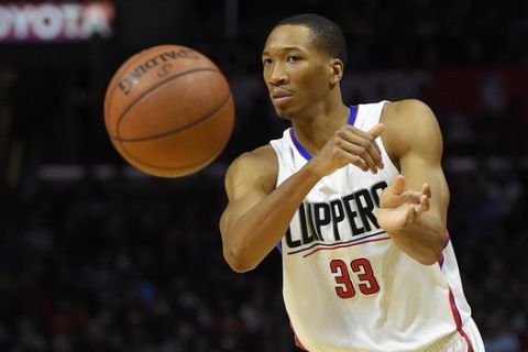 Los Angeles Clippers forward Wesley Johnson passes the ball during the first half of an NBA basketball game against the Minnesota Timberwolves, Wednesday, Feb. 3, 2016, in Los Angeles. (AP Photo/Mark J. Terrill) 
